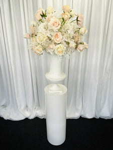 White round cylinder plinth with slimline urn & Alanah floral