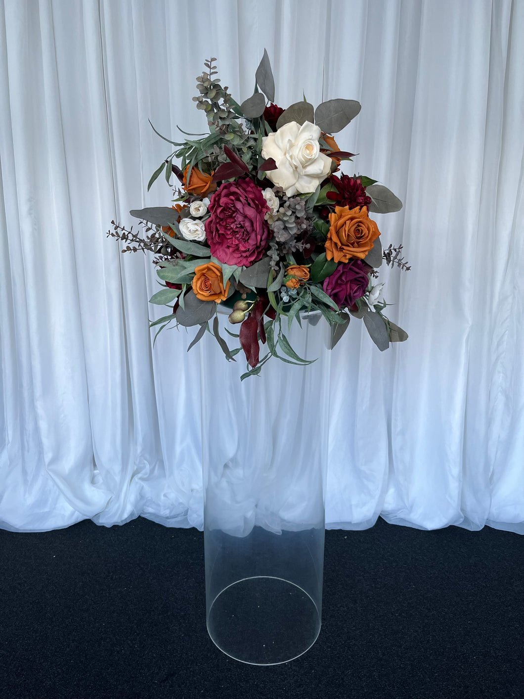 Clear round cylinder plinth with Mackenzie floral