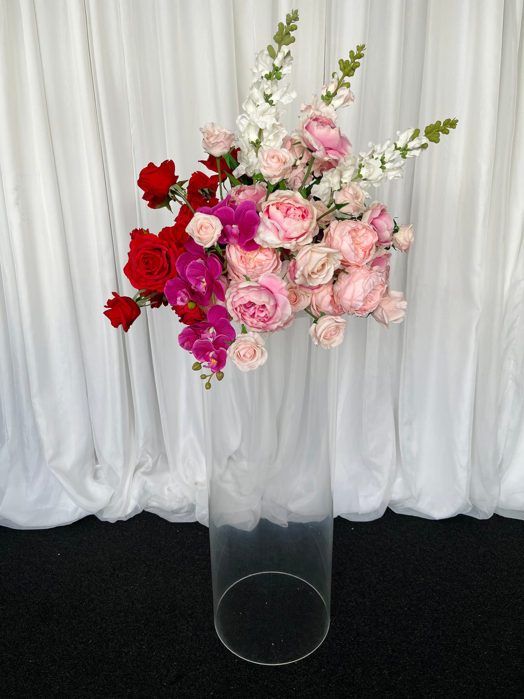 Clear round cylinder plinth with Lola floral