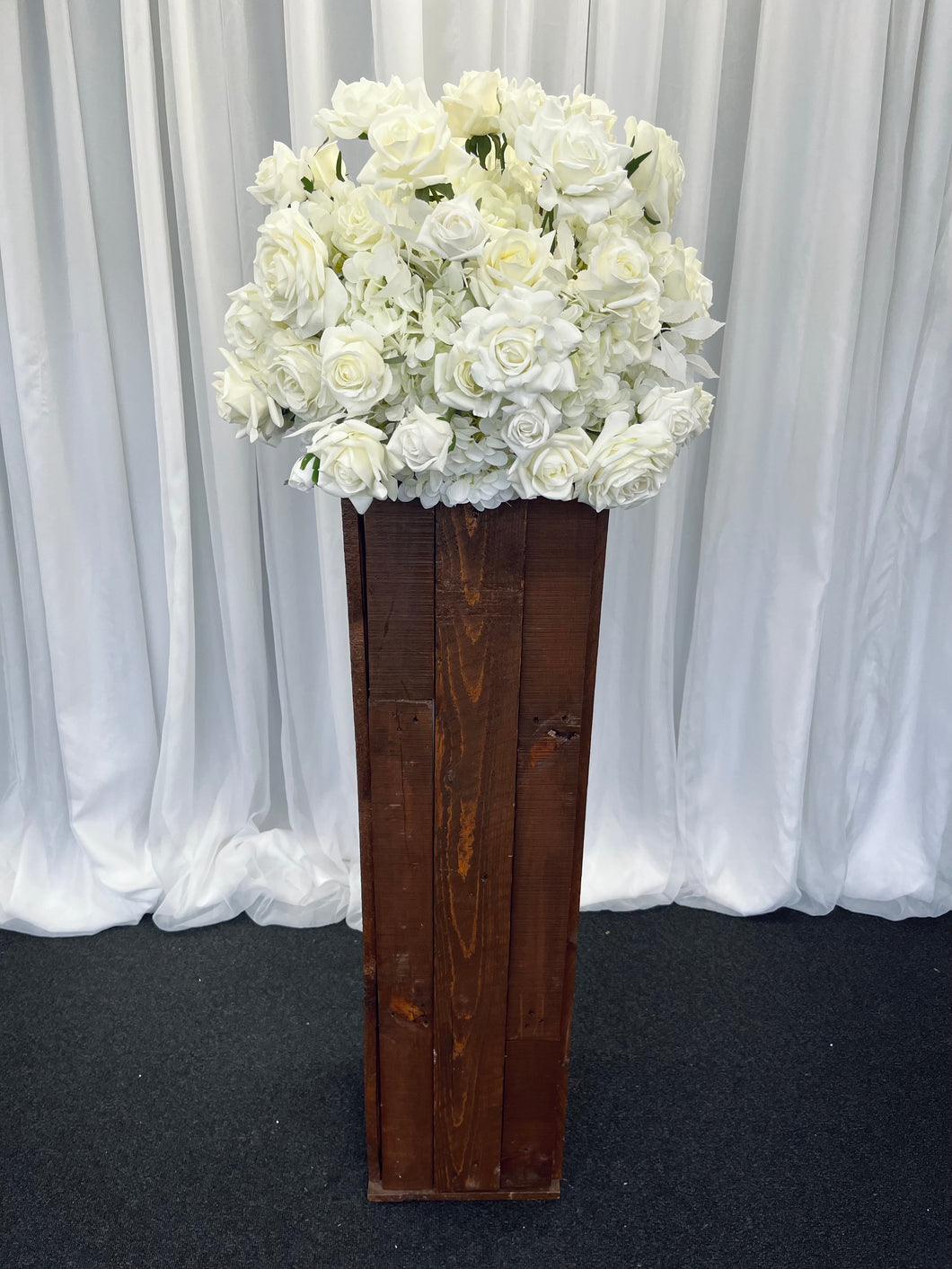 Rustic wooden plinth with Eve floral