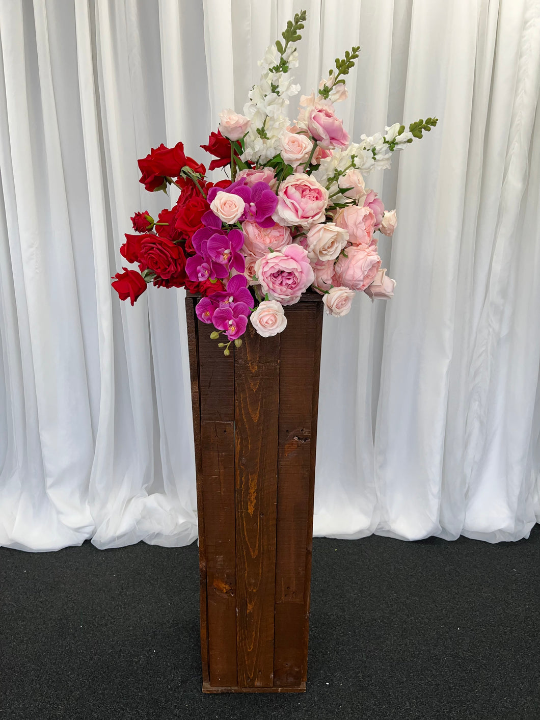 Rustic wooden plinth with Lola floral