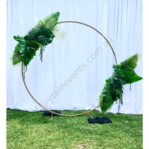 Gold Circle Backdrop With Tropical Leaf