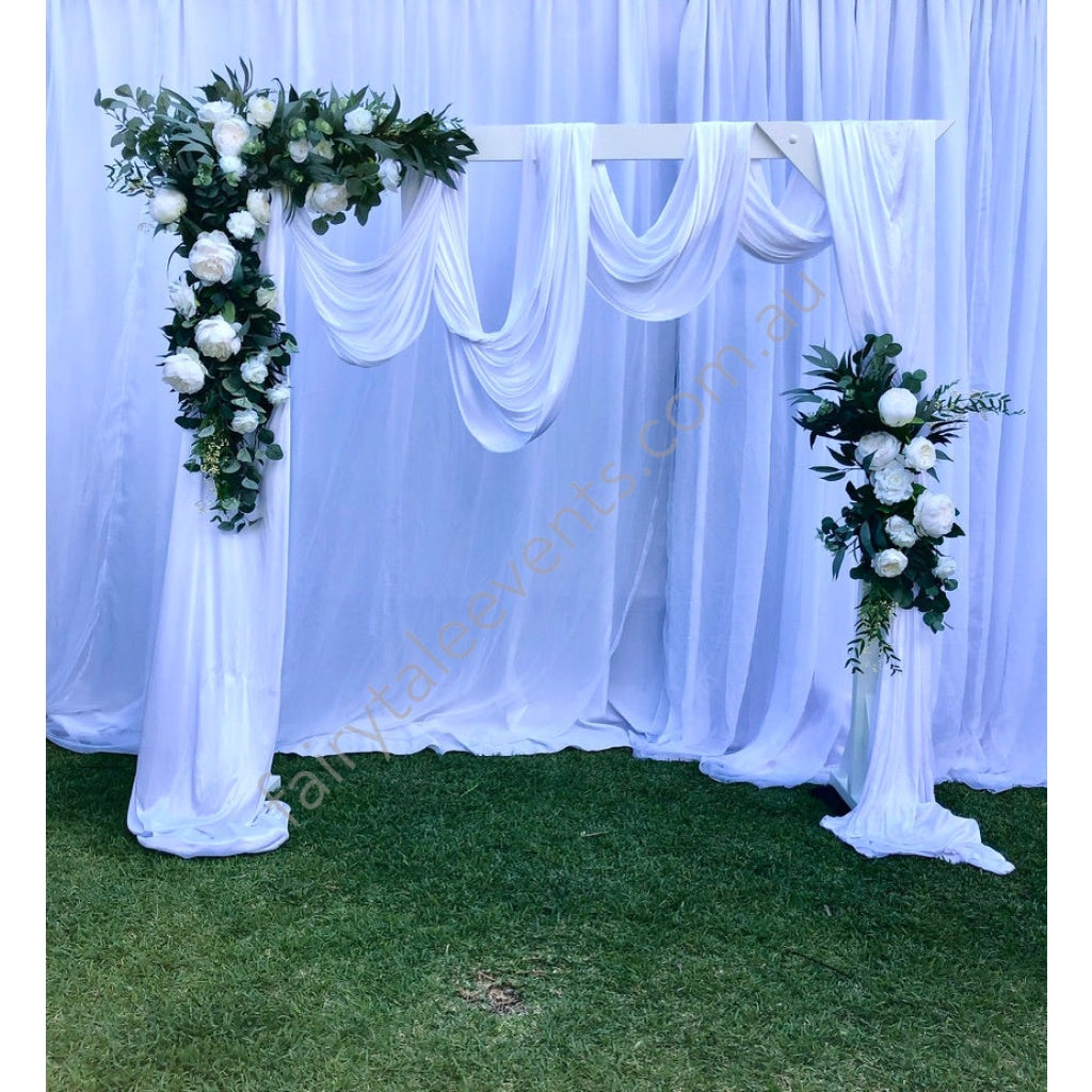 Sarah floral on white arbour with drape – Fairytale Events Pty Ltd