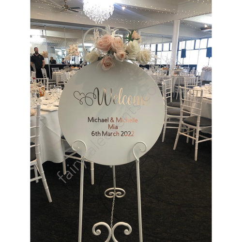 White Round Sign With Alanah Floral On White Easel