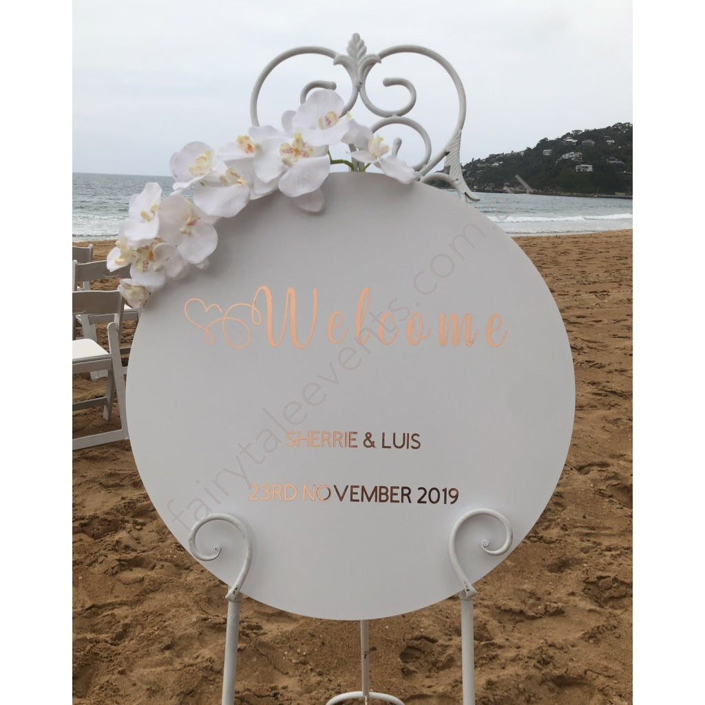 White Round Sign With Eve Floral On White Easel