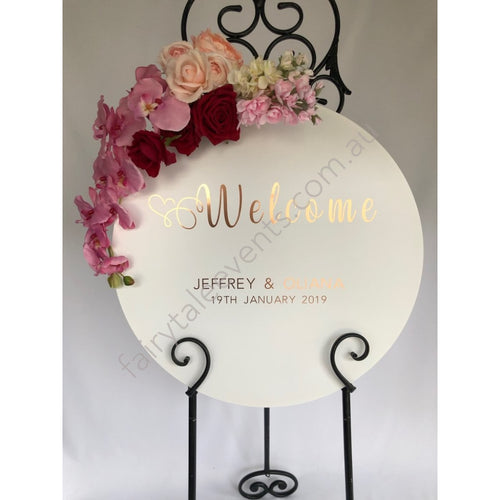 White Round Sign With Lola Floral On White Easel